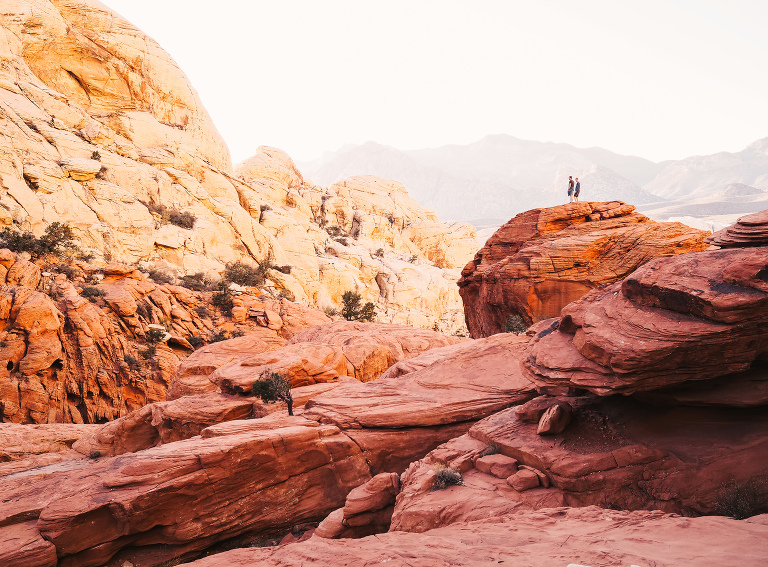 people in red rock canyon surrounded by rocks