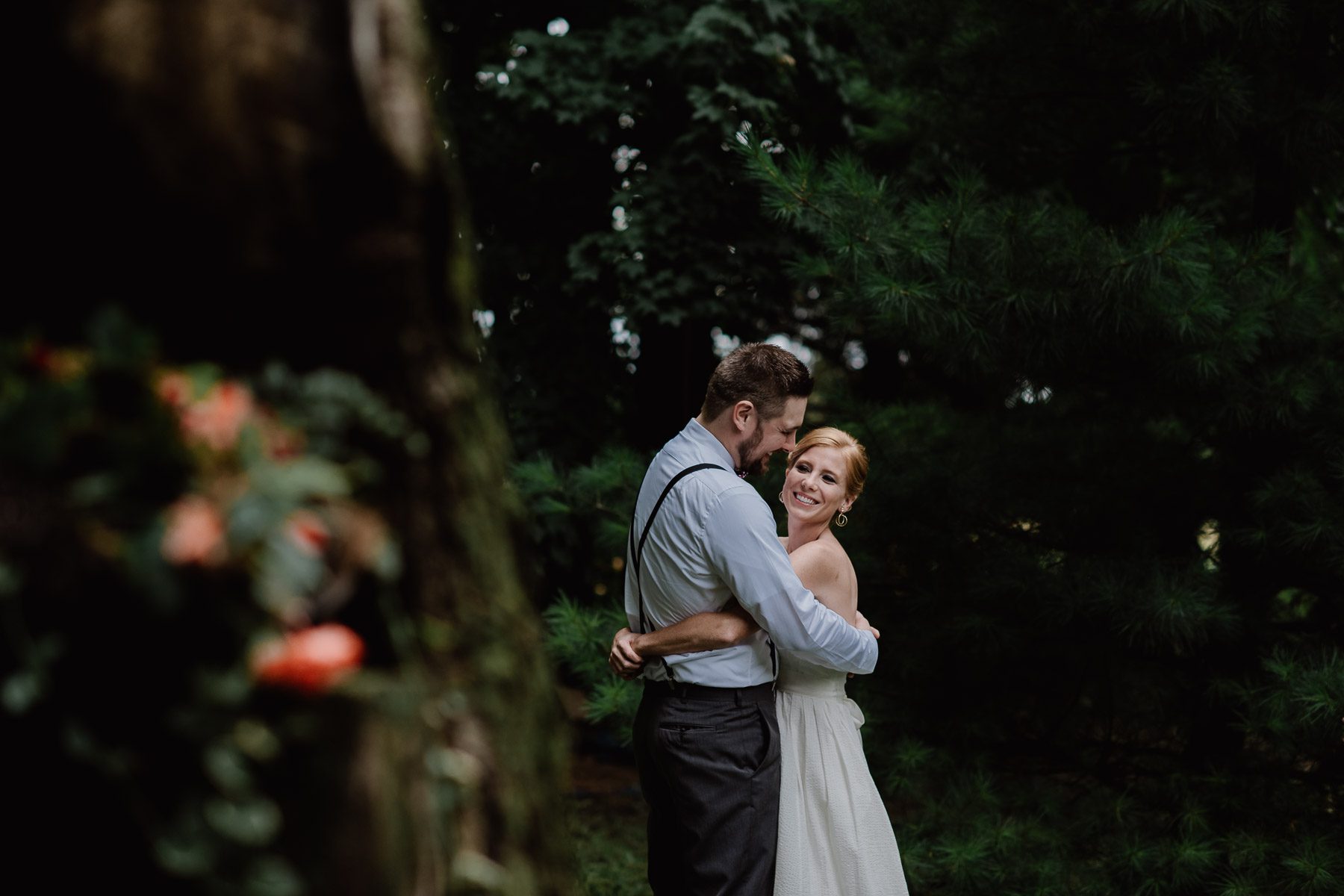bride and groom in nature hugging