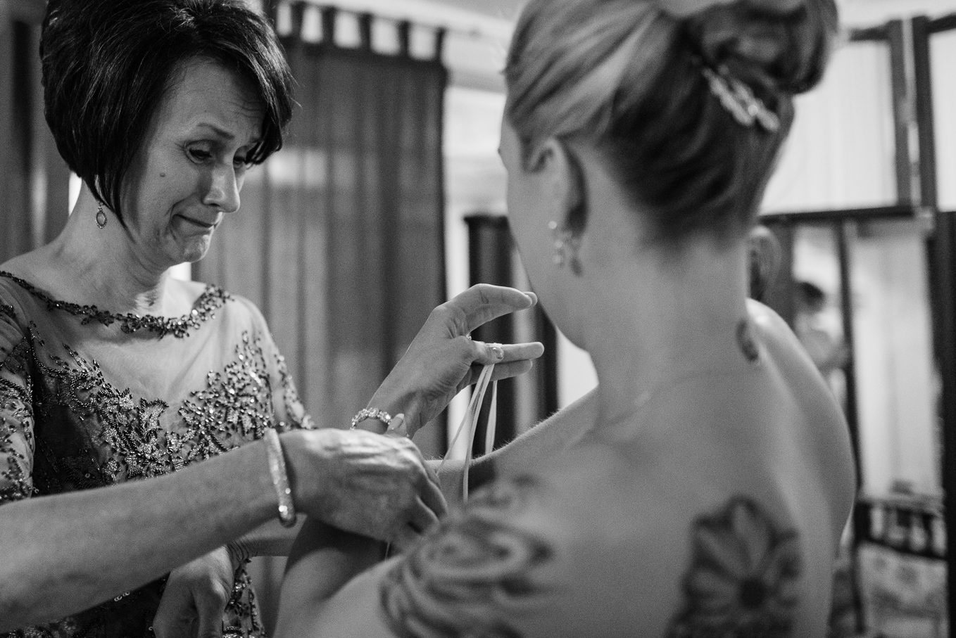 Touching moment between mother of bride and bride.