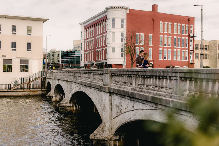 engaged couple on Janesville bridge