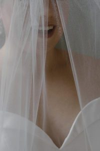 Bride's face through wedding veil