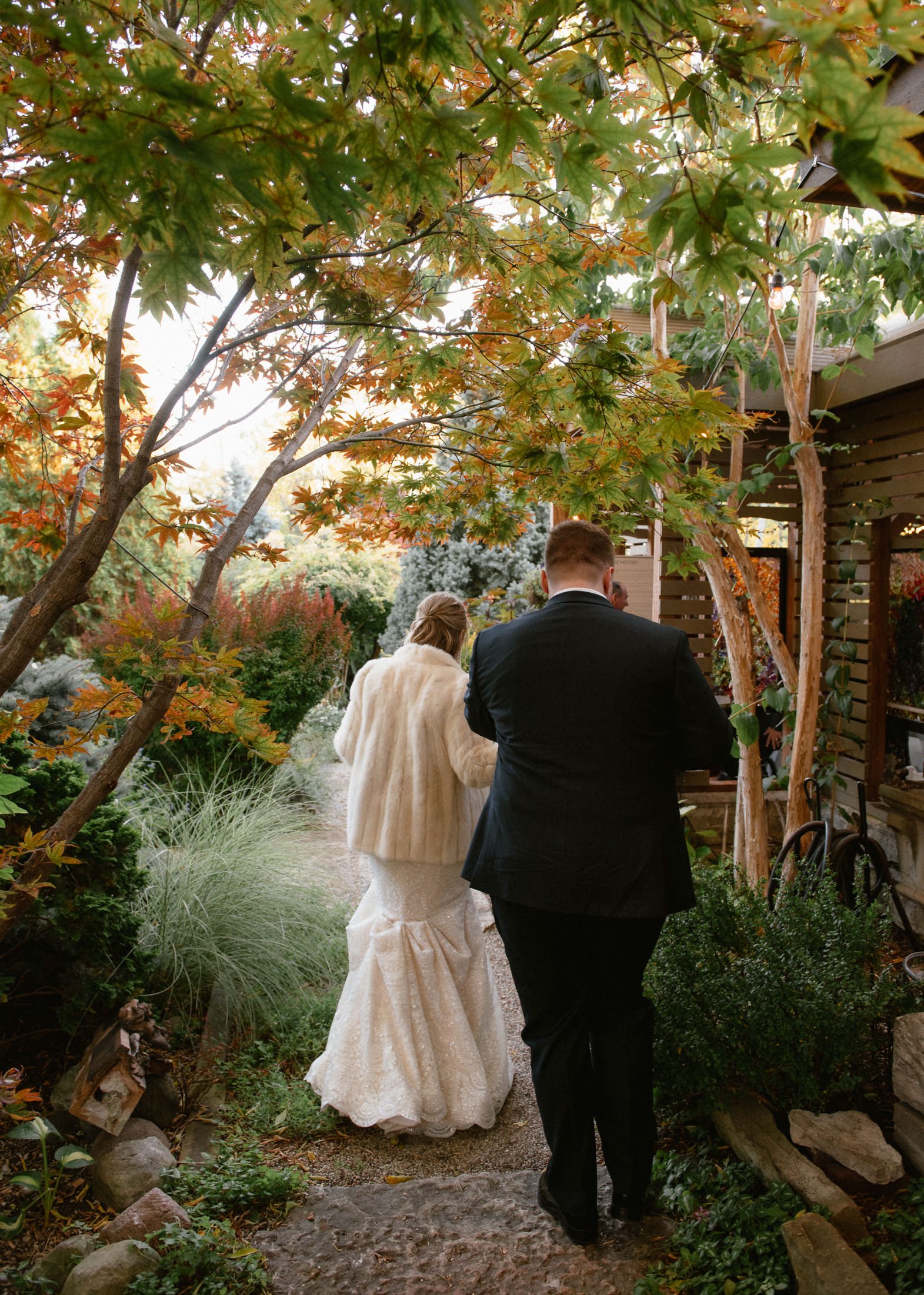 Bride and groom walking to dinner at Sanger House in Milwaukee.