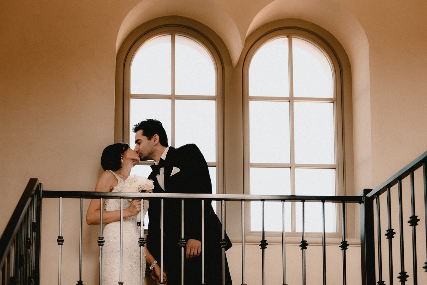 First look kiss between bride and groom.