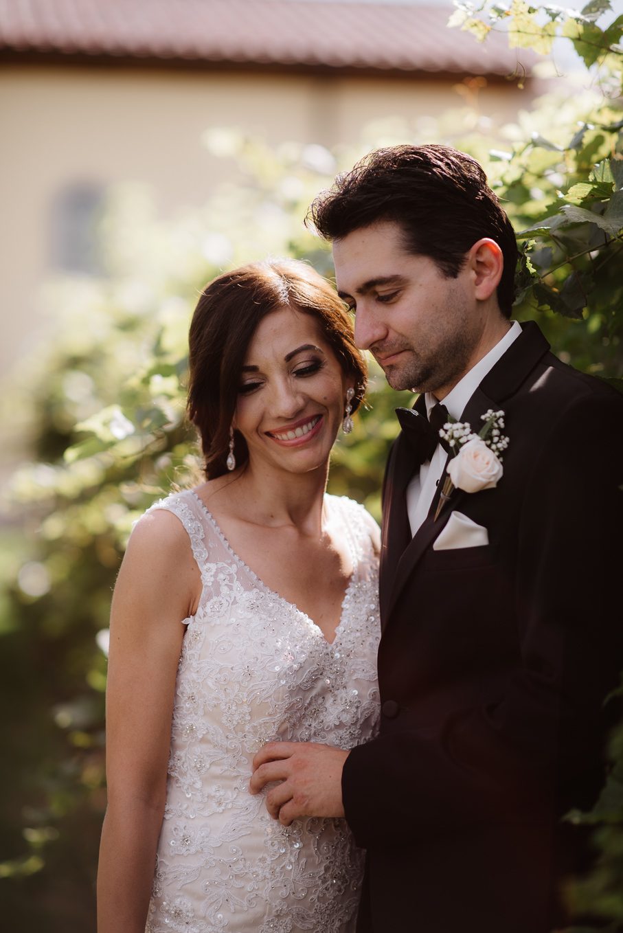 Bride and groom laughing.
