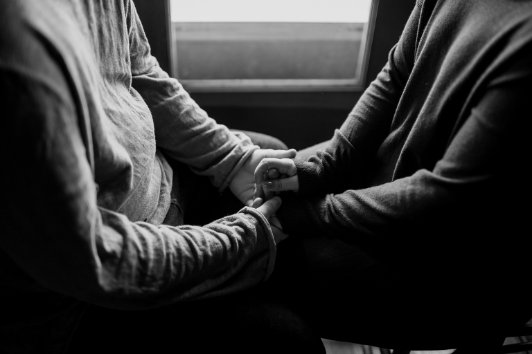 hands in window light in cabin on lake wisconsin