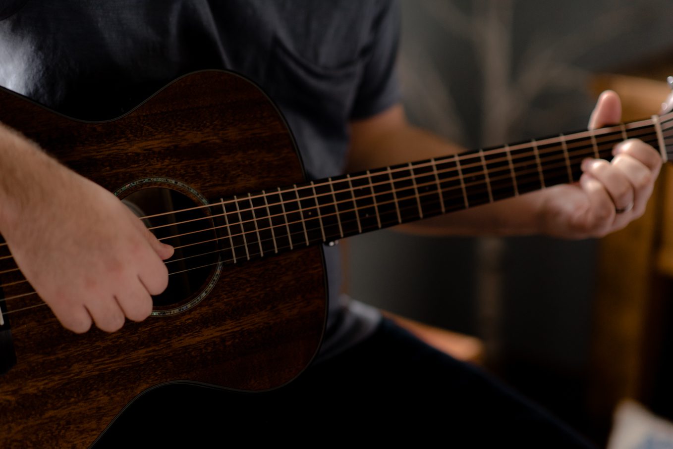 husband playing guitar