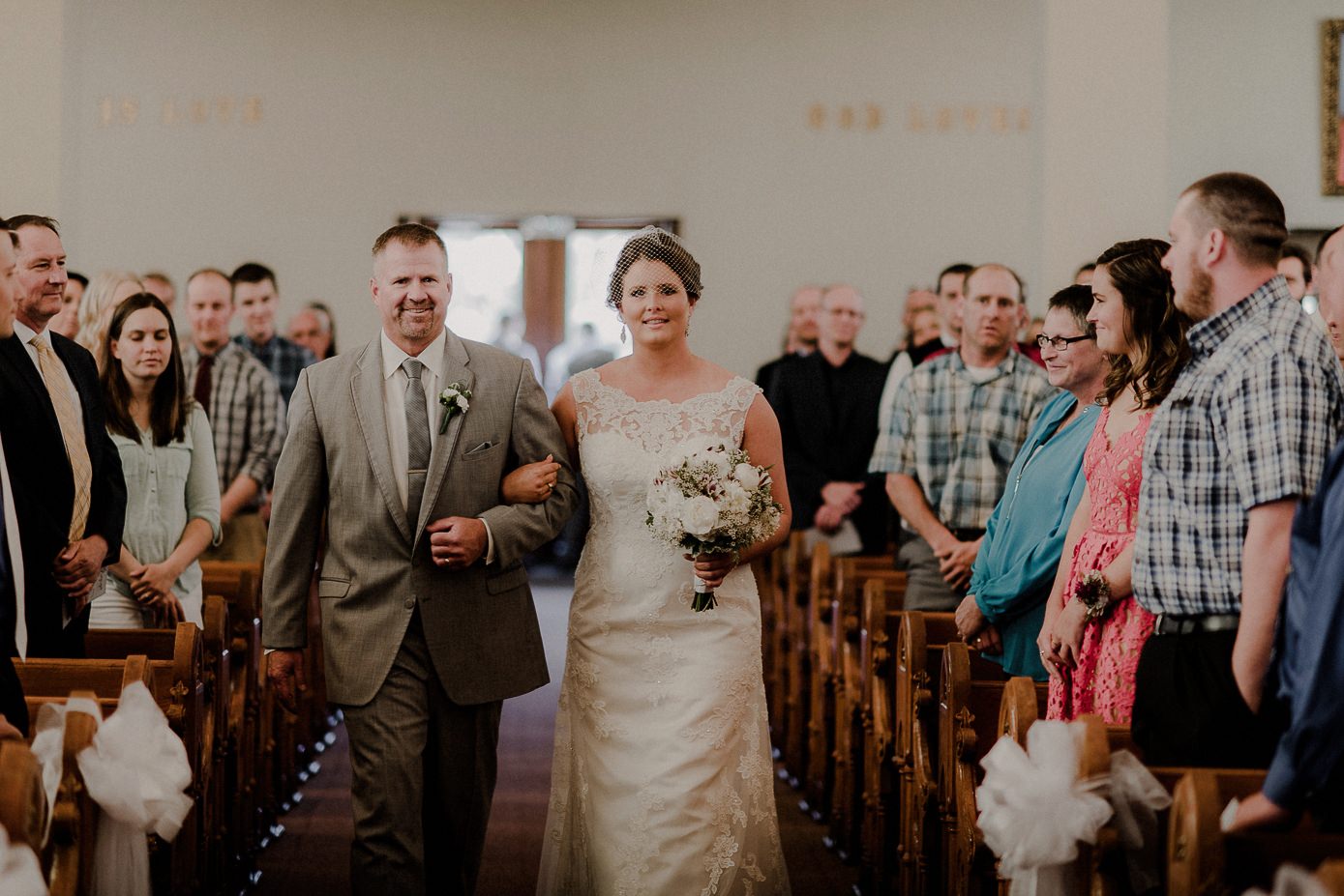 Wisconsin bride walking down the aisle