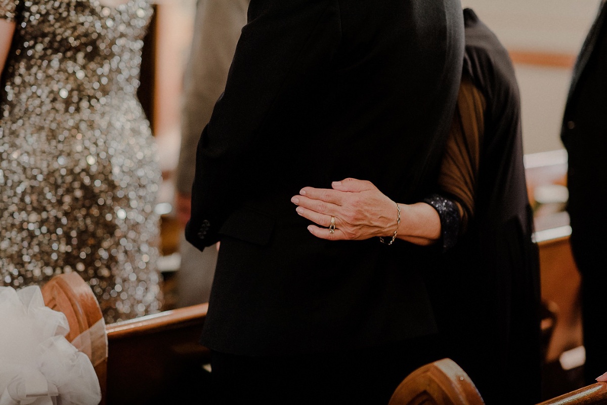 Grandmother resting hand on her husband