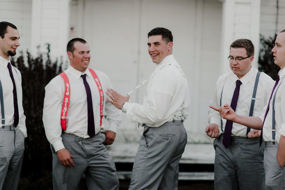 Baraboo wedding groom with groomsmen and suspenders