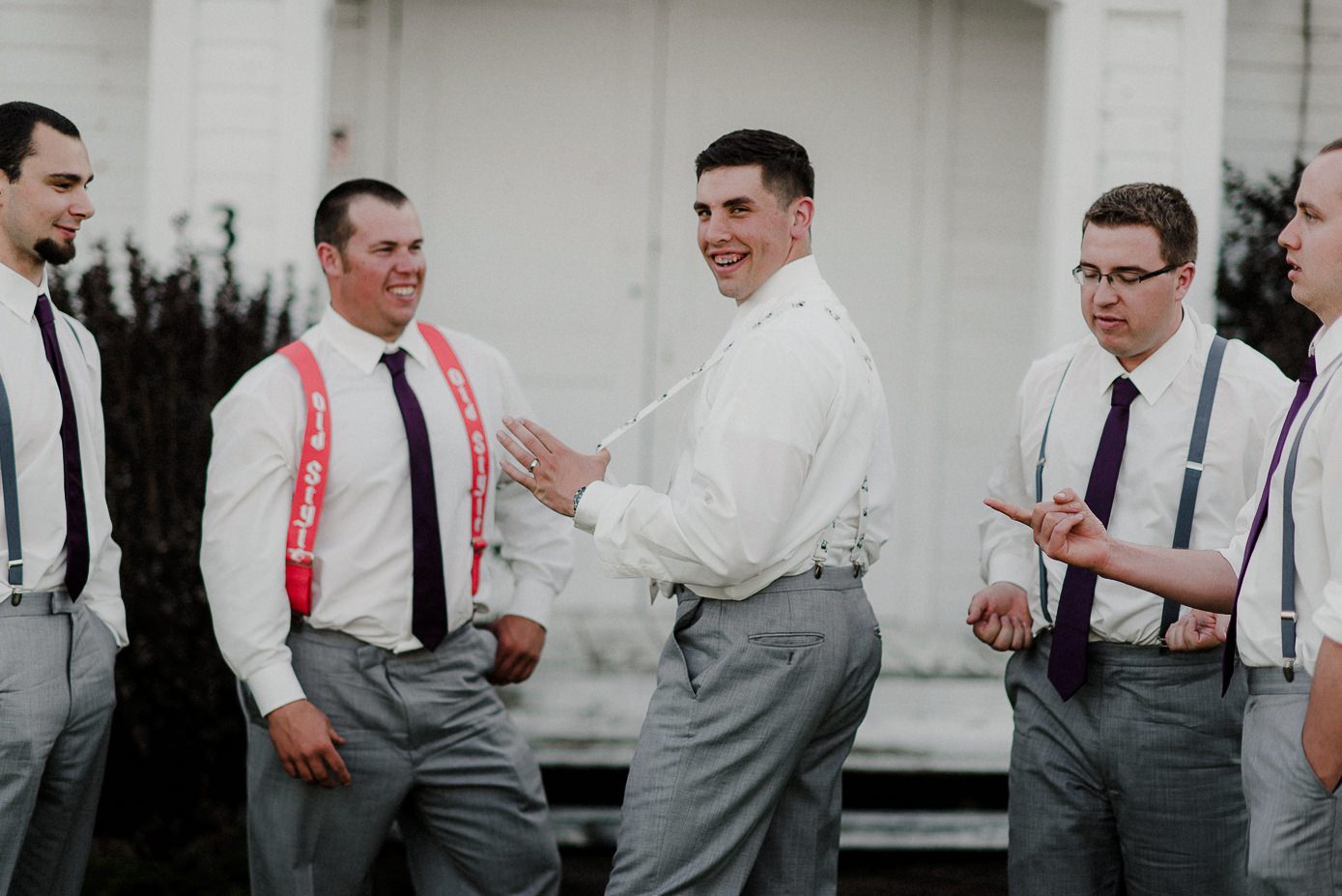 Baraboo wedding groom with groomsmen and suspenders