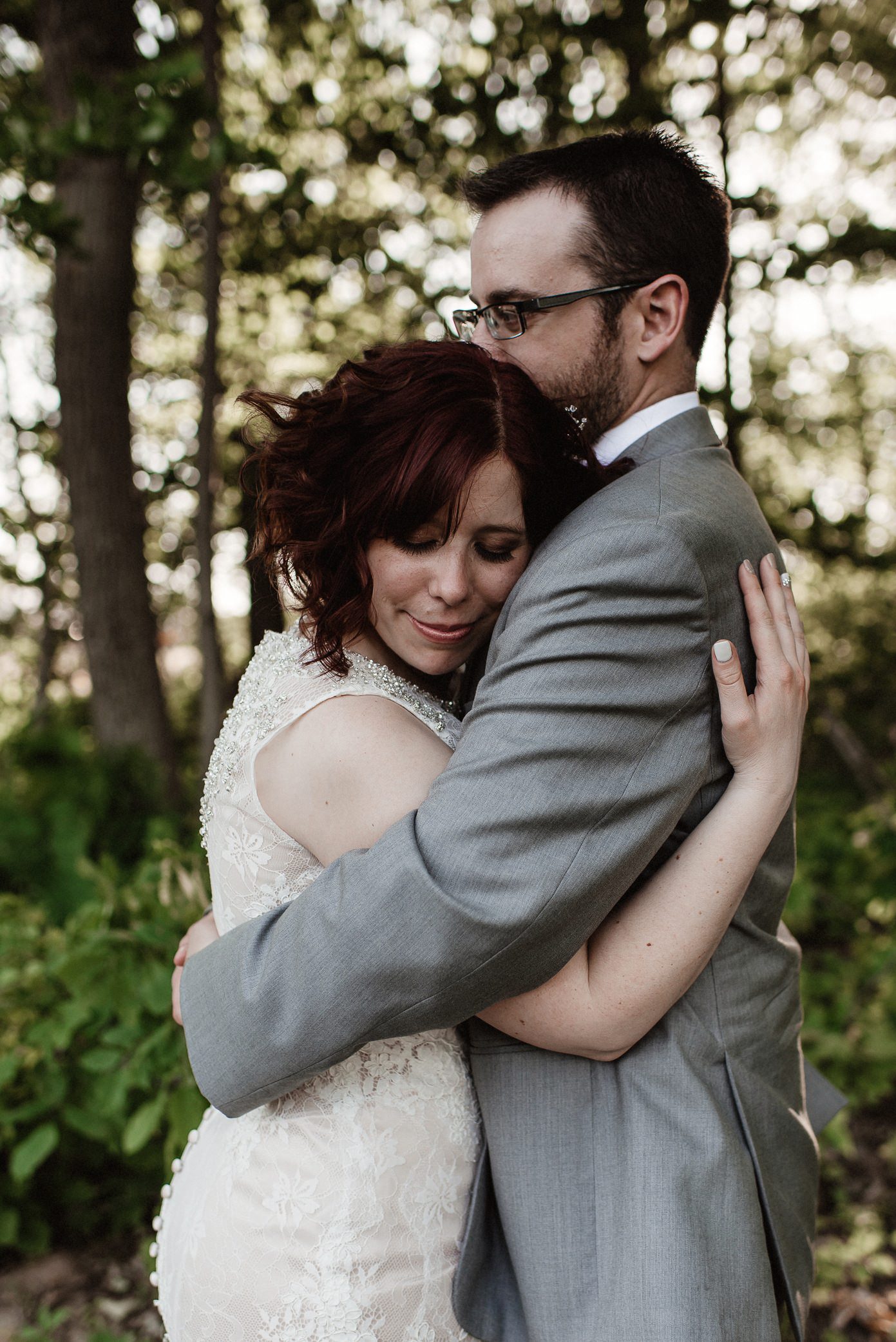 Groom holding his bride
