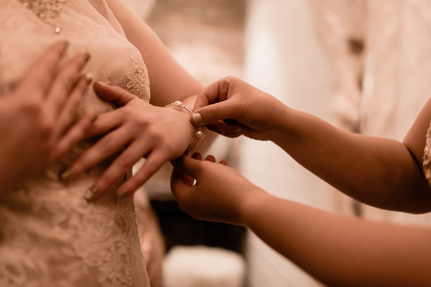 Bride putting on her accessories