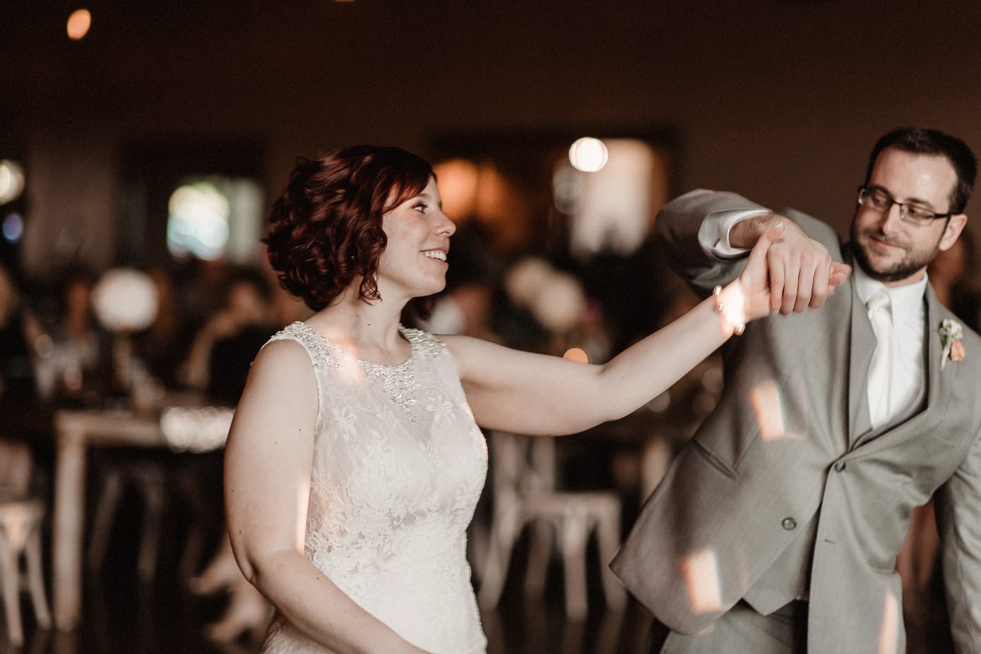Groom spinning his bride