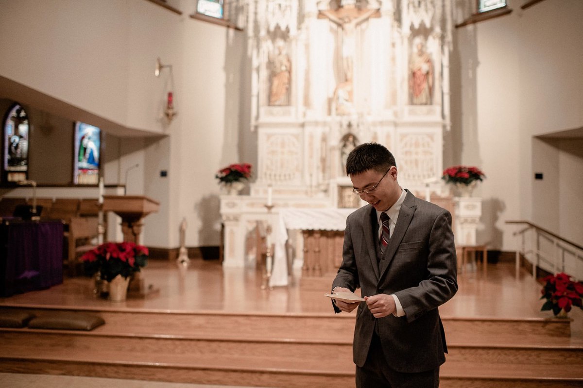 Groom reading letter from his bride