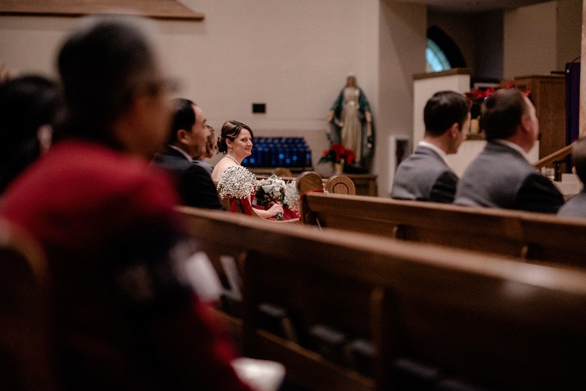 Bridesmaid looking at bride during ceremony