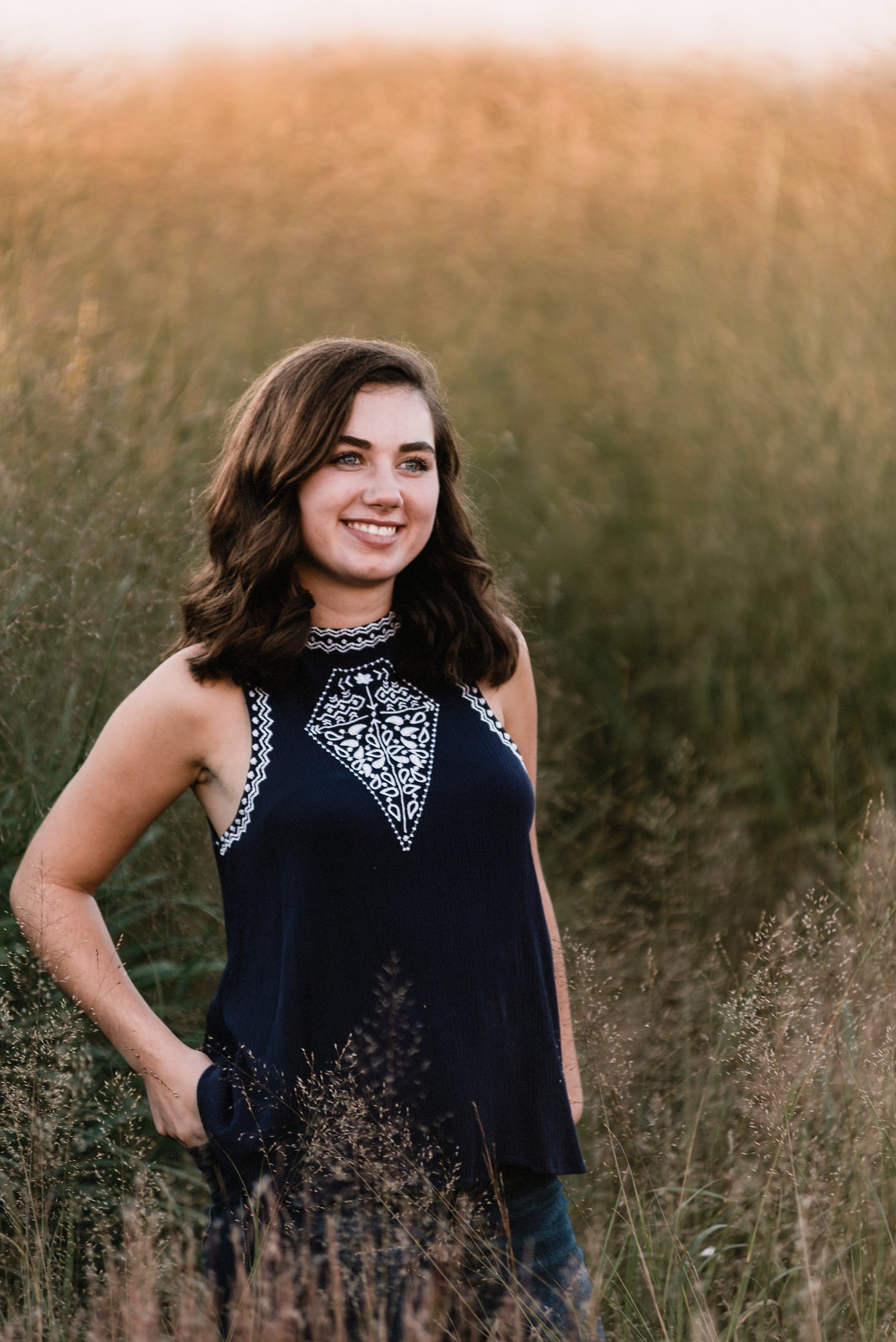 High school senior in tall grass