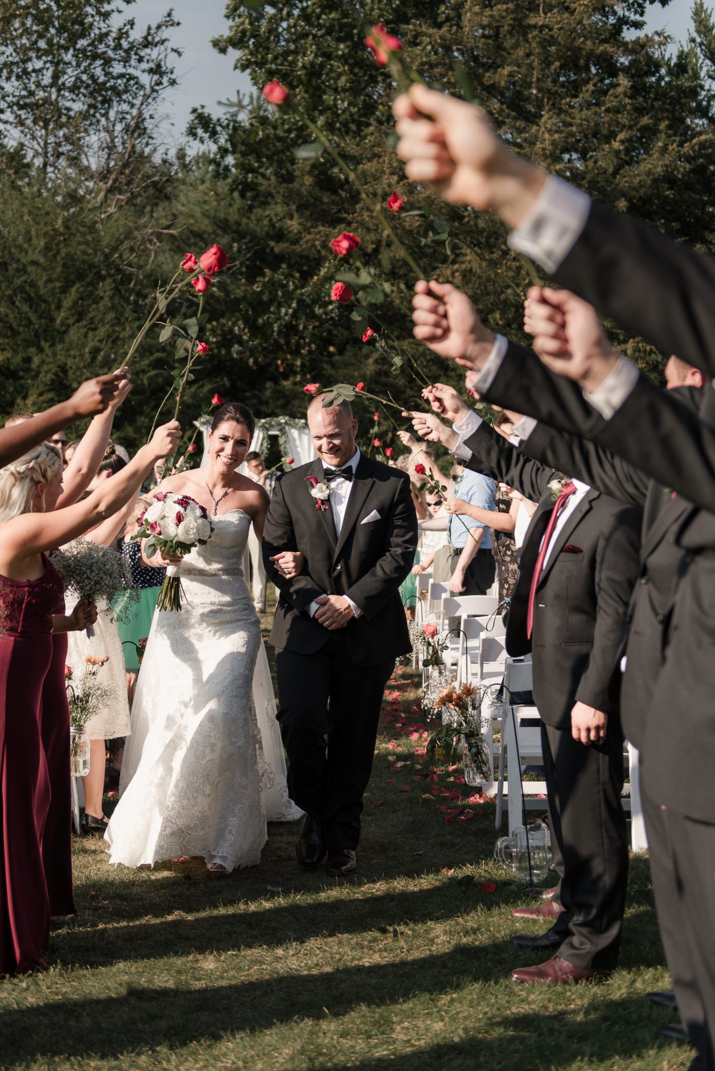 Recessional with tunnel of red roses