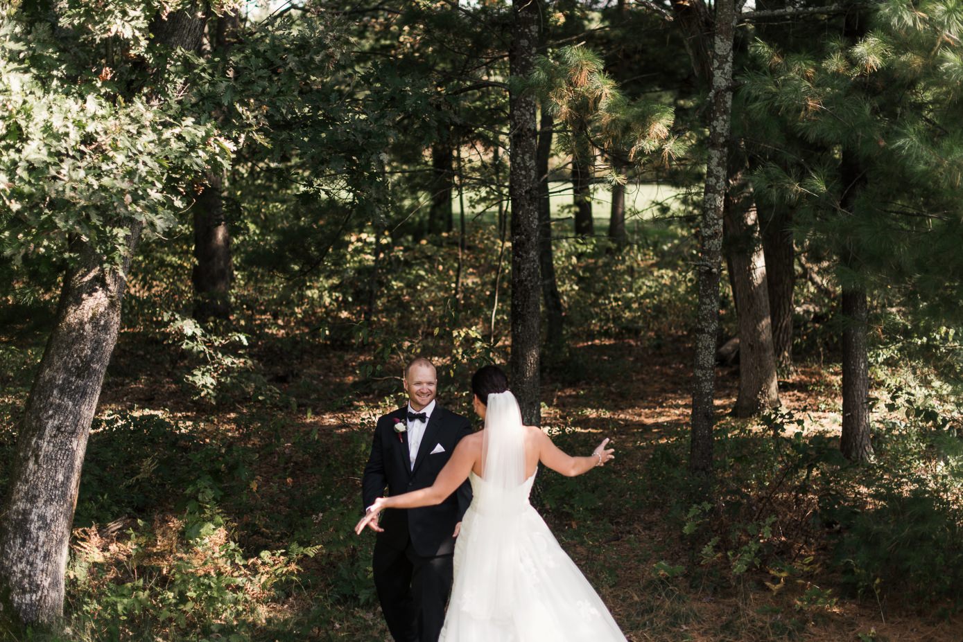 Groom seeing bride for the first time during first look