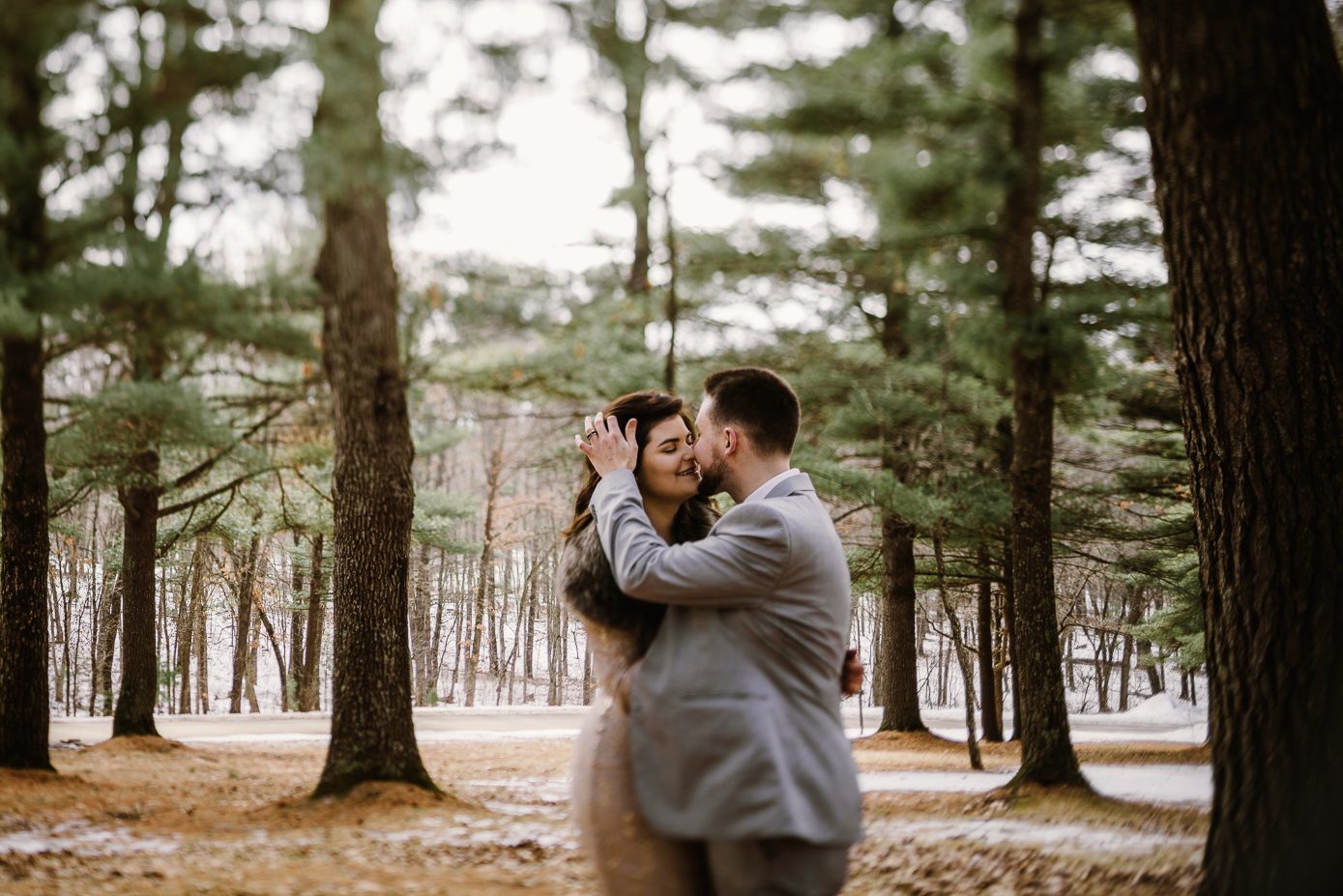 Bride and groom in northern woods at Mirror Lake