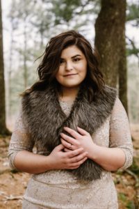 Bride with fur shawl and ruby ring.