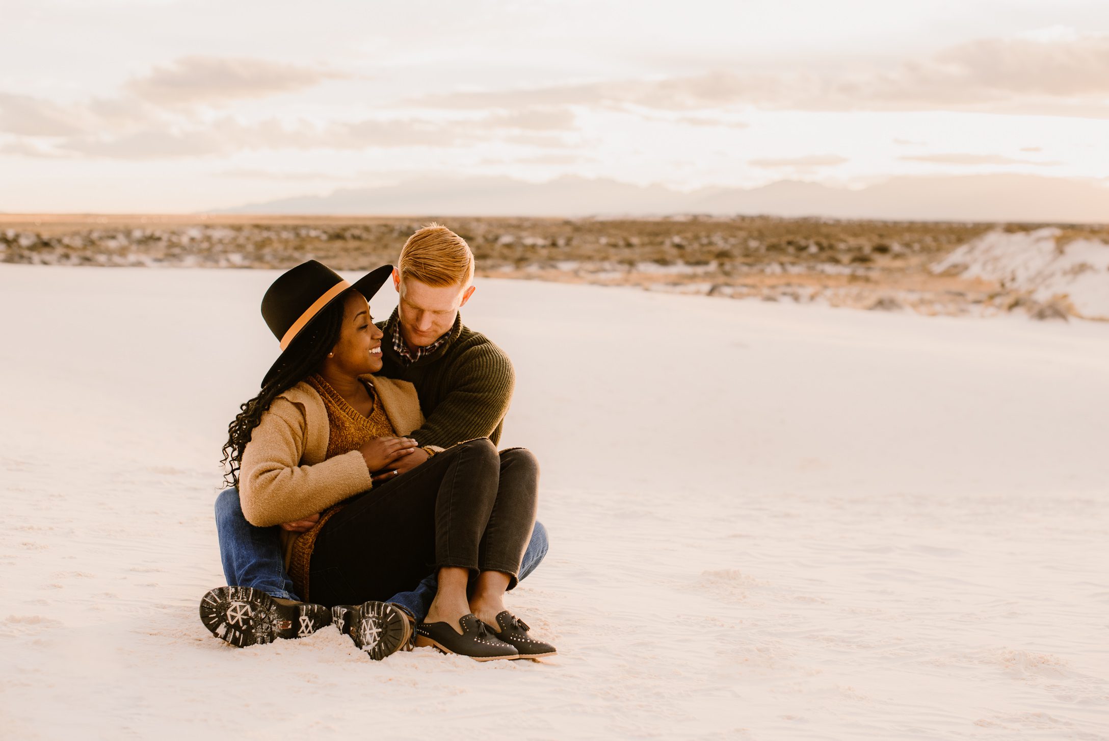 Couple holding each other at White Sands