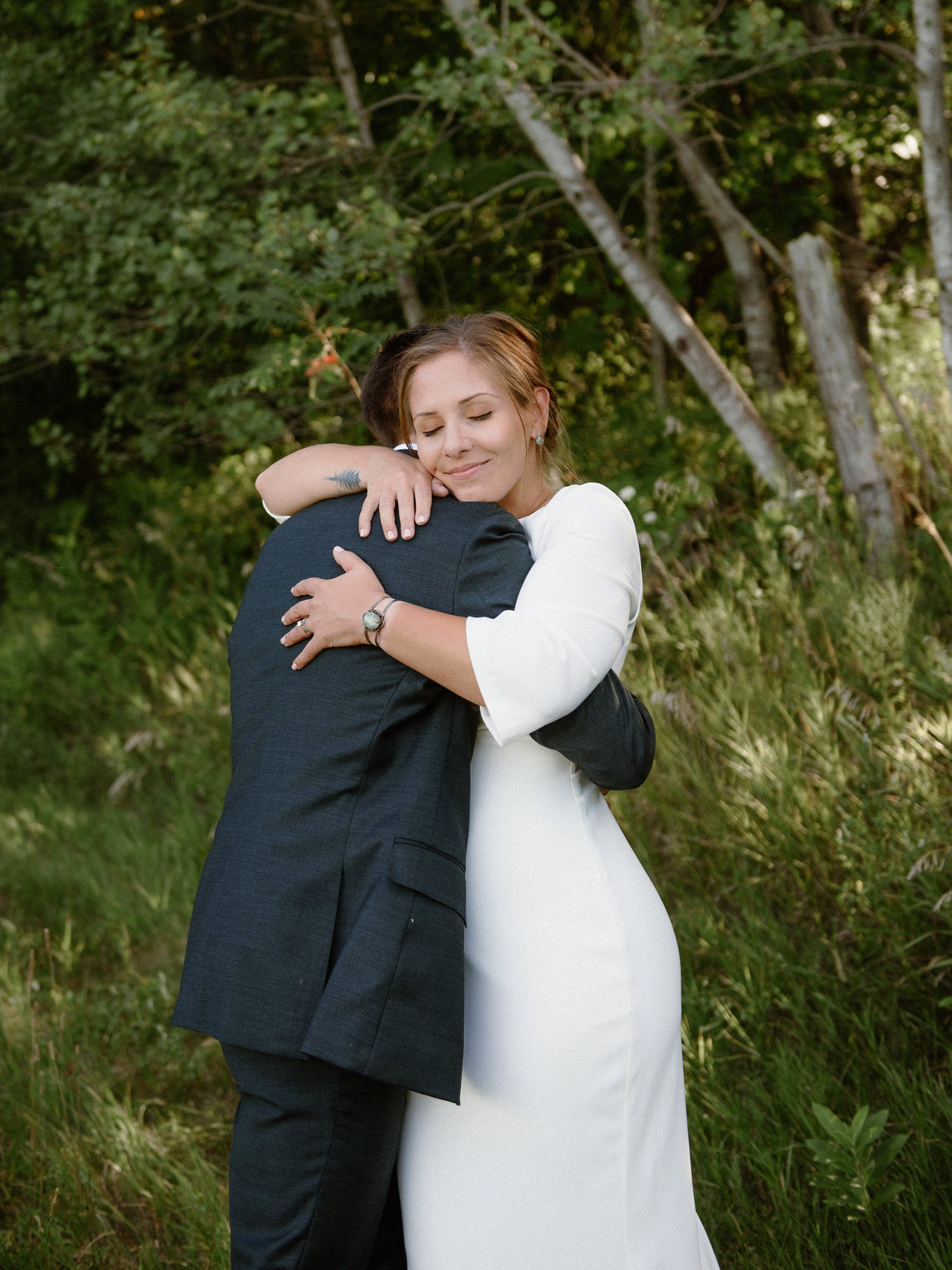 Bride and groom intimate hug