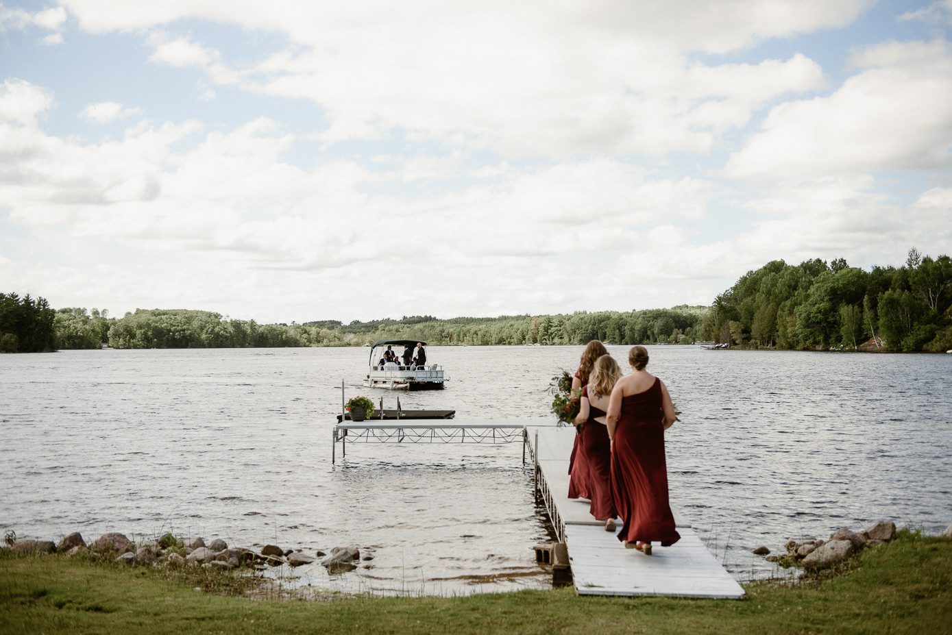 Groom arrives to wedding ceremony on pontoon boat
