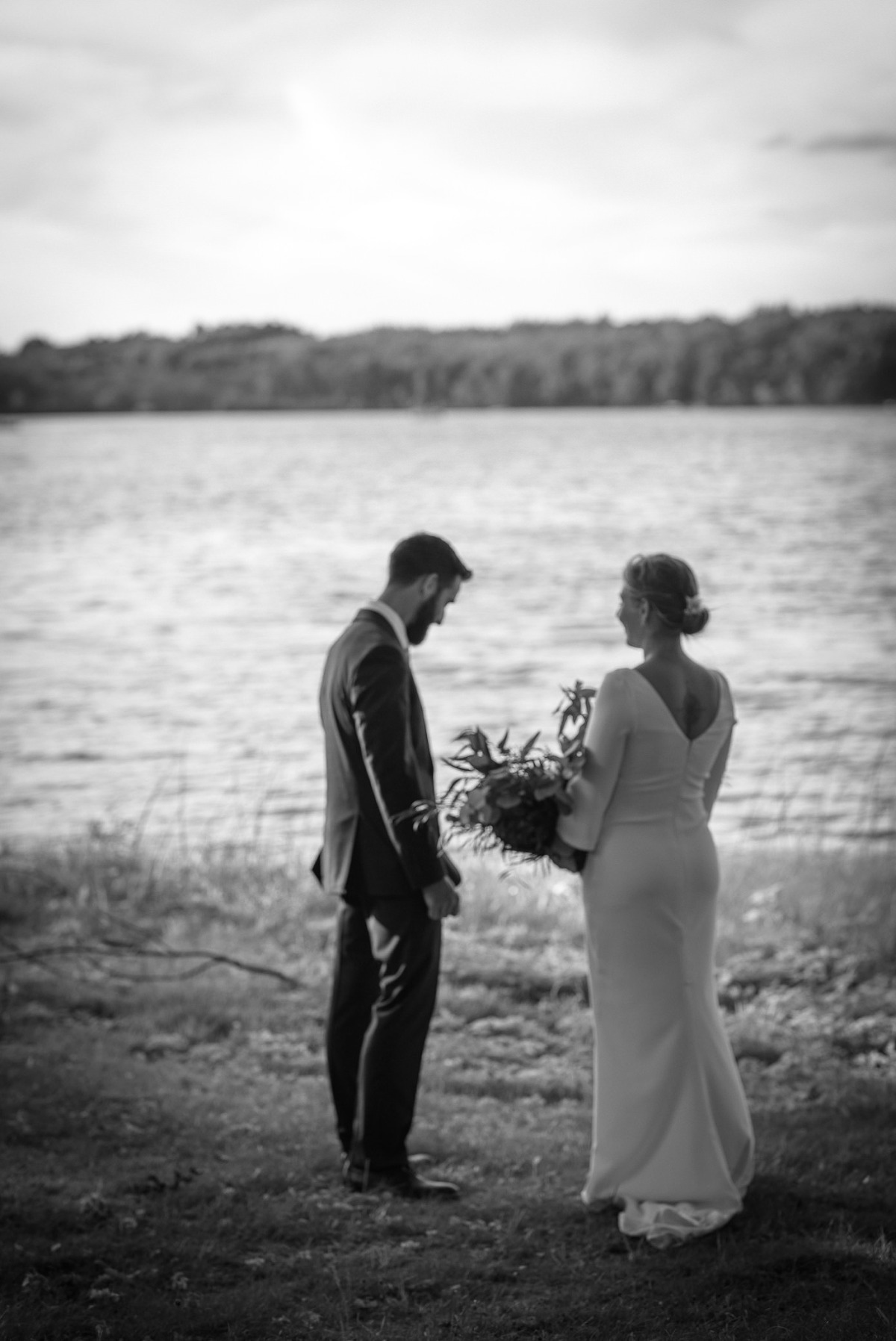 Black and white wedding photo of bride and groom