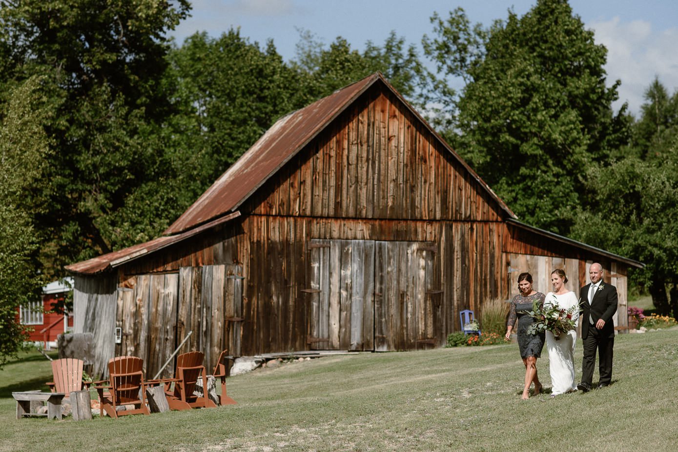Parents walking bride to wedding ceremony