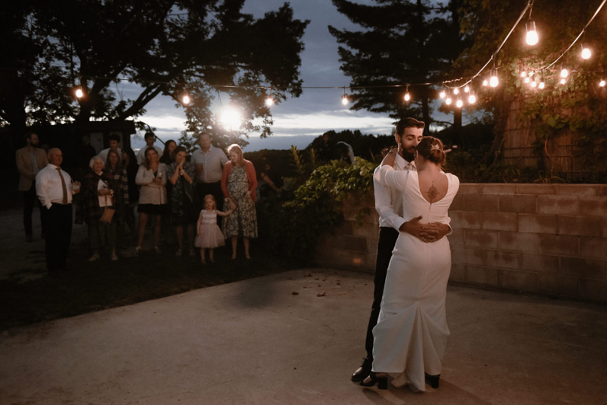 bride and groom dancing at night