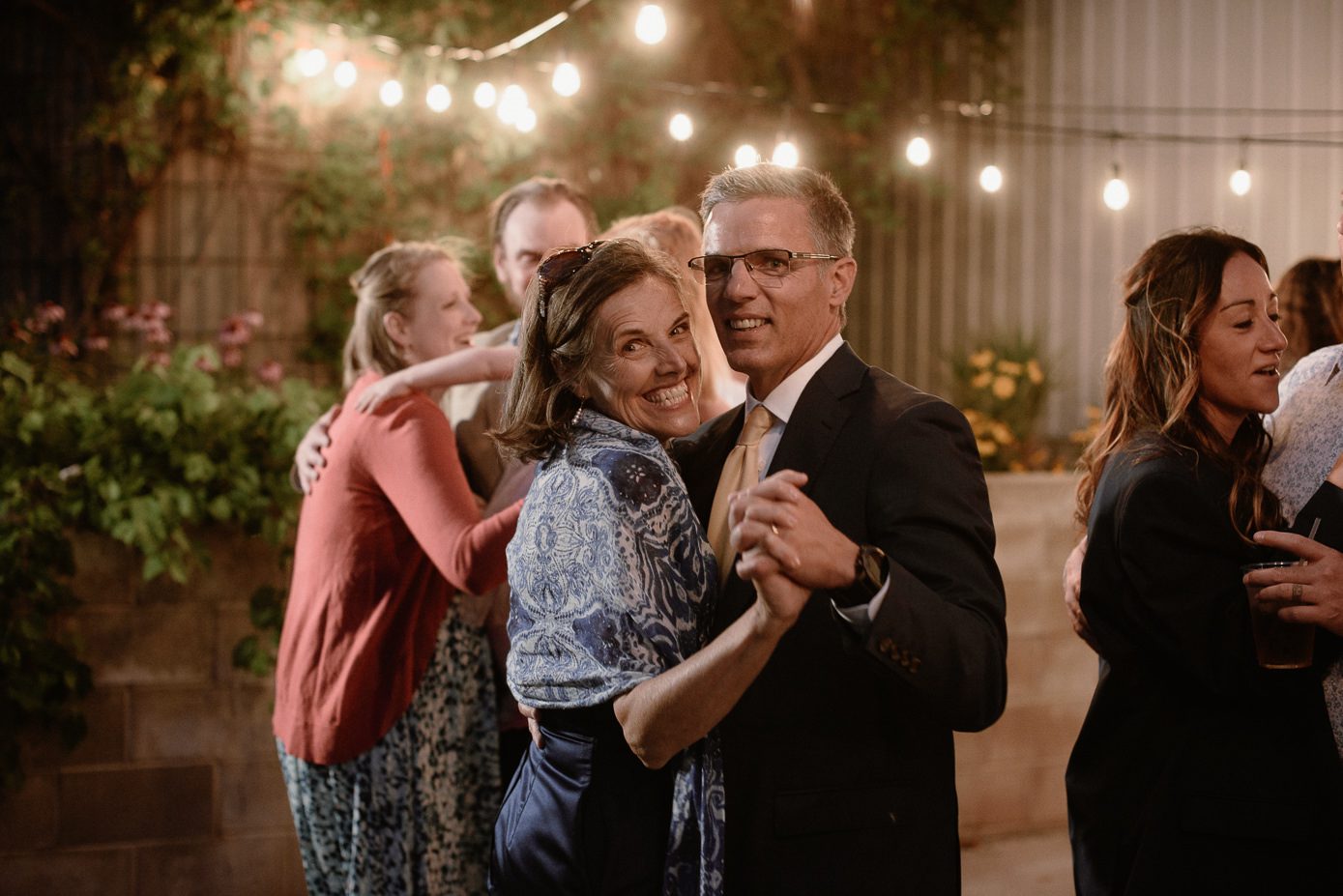 grooms parents dancing at wedding