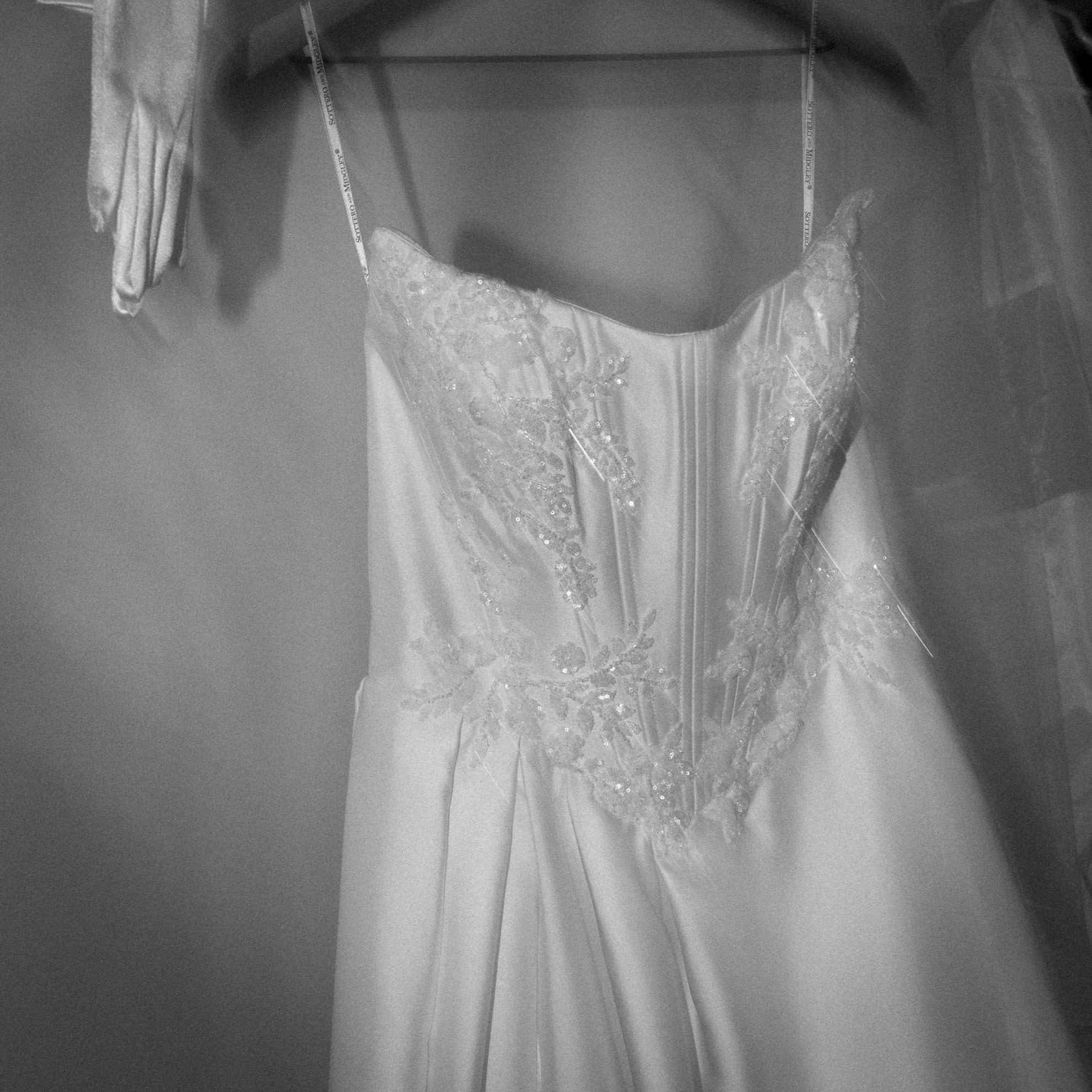 Bridal details of Amadora wedding dress by Sottero and Midgley and gloves.