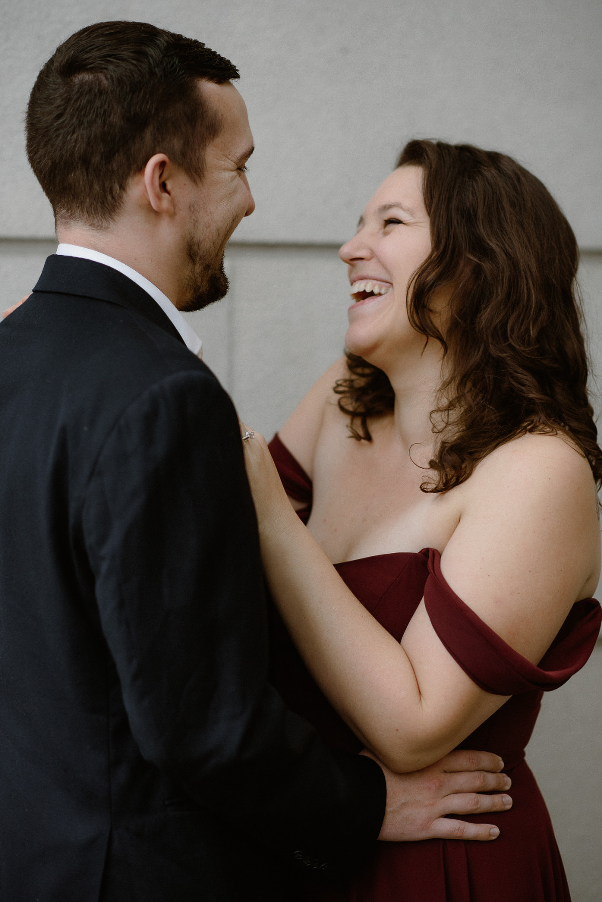 Engaged couple laughing