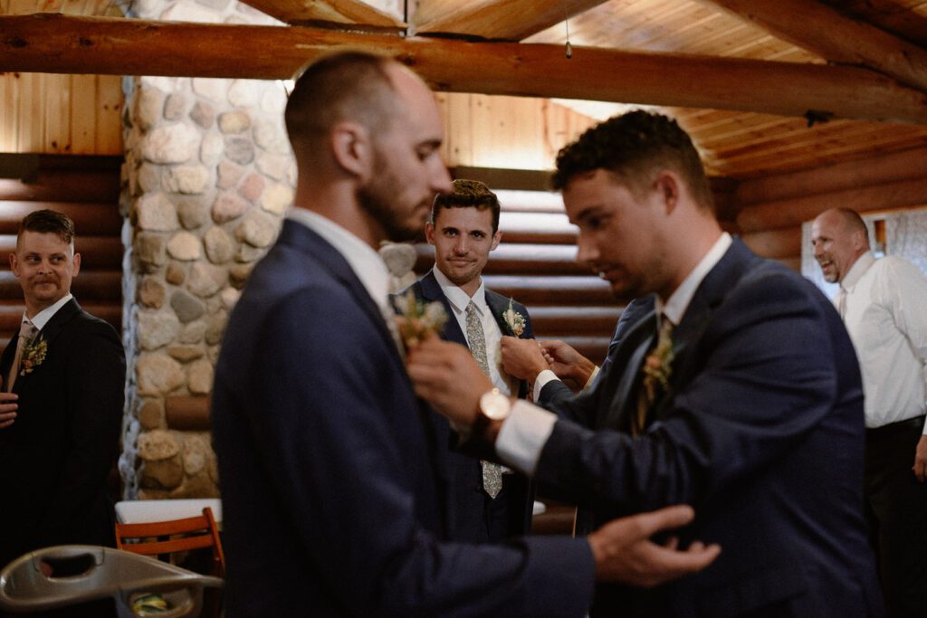 Groom getting ready for ceremony at Bubolz Preserve