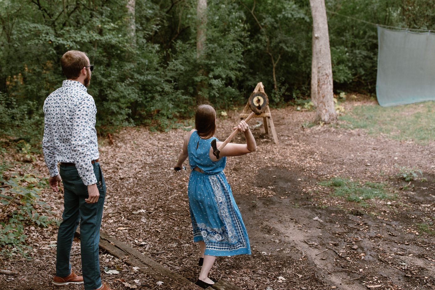 axe throwing at camp wedding