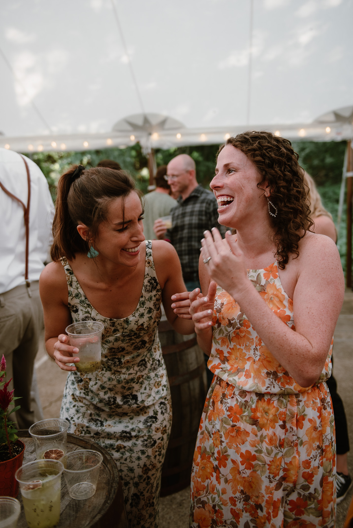 wedding guests laughing at cocktail hour