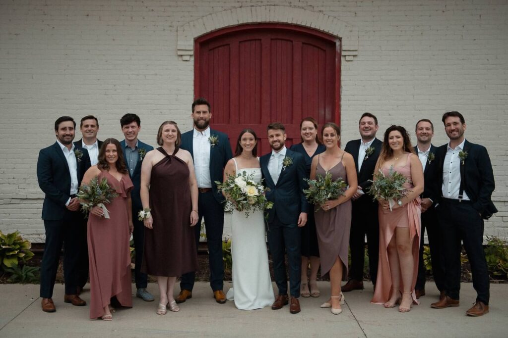 Outdoor formal wedding bridal party portrait.