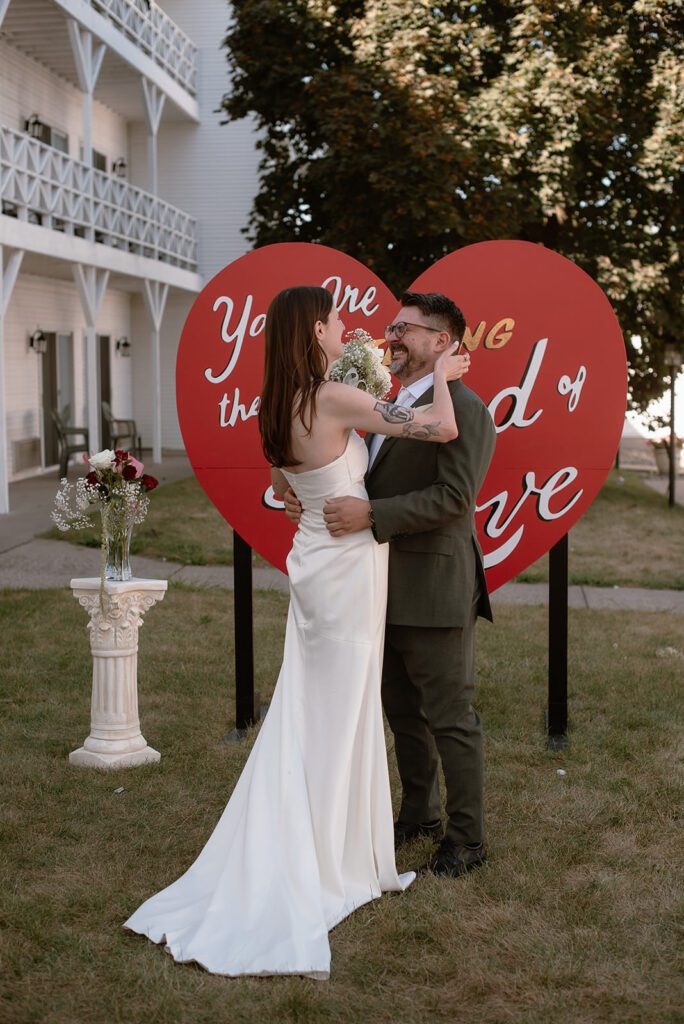 unique kitsch style wisconsin wedding with 'you are entering the land of love' sign